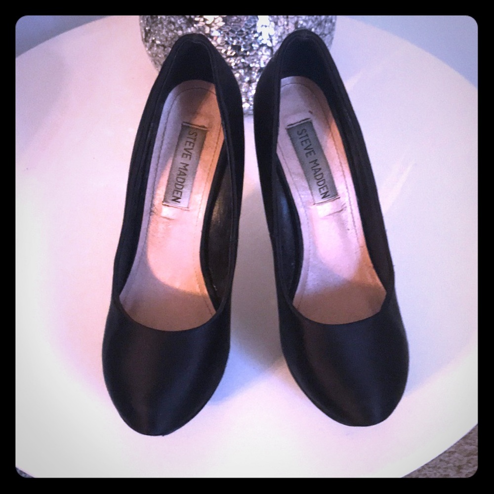 Black pumps with rhinestoned heels.